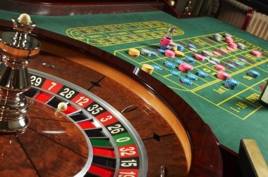 Live Roulette studio with dealer and spinning wheel